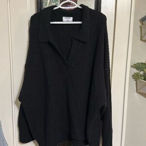 Black oversized knit collared sweater.
